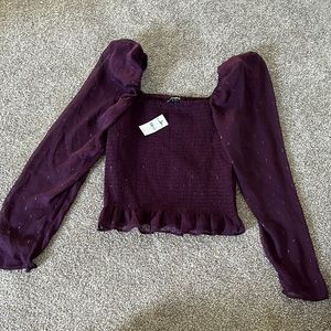 Small express top. Never worn with tags on still.